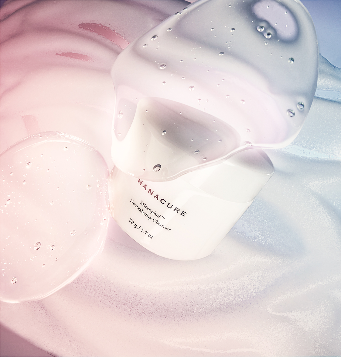 Woman holding a Hanacure brush near her face