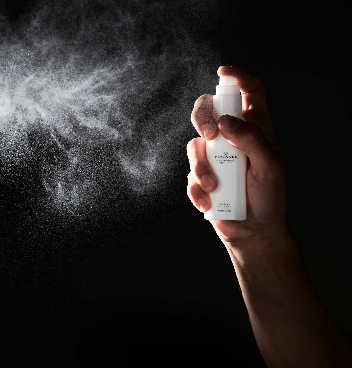 Woman holding a Hanacure brush near her face